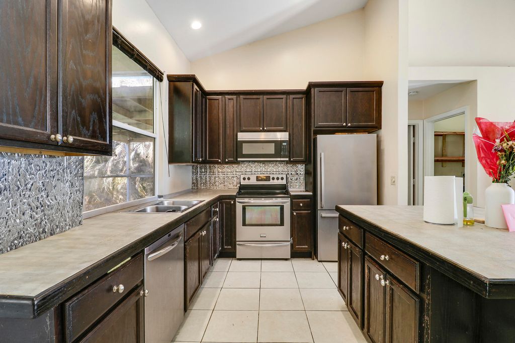 Photo of 533 NW Avon Avenue, Port Saint Lucie, FL 34983 (MLS # B26001627)