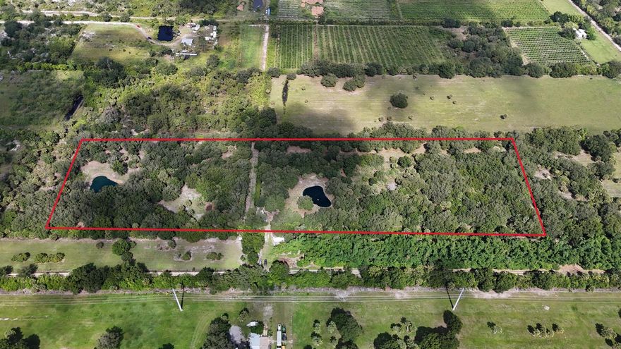 This exceptional property boasts over 10 fully fenced, high, and dry acres in Martin County, meticulously maintained and improved to perfection. Two strategically placed ponds serve the southern and northern halves, respectively. Situated at approximately 28ft above sea level, the property features a cross fence, multiple shaded and feed pole barns, wells, electric, and an impressive 680ft shooting range. Notably, this 10-acre parcel offers the potential to be subdivided into two 5-acre lots, meeting the minimum requirement for building in the A-2 zoning district. A must see to truly understand and appreciate how great this property is.