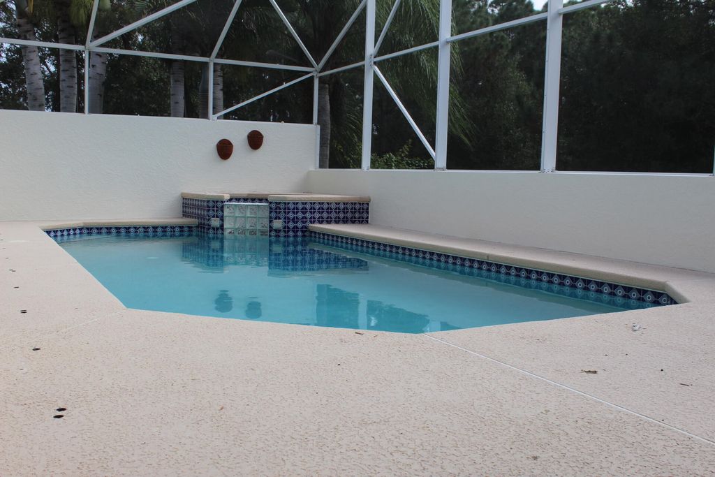 Photo of 639 SW Lake Charles Circle, Port Saint Lucie, FL 34986 (MLS # R11079284)