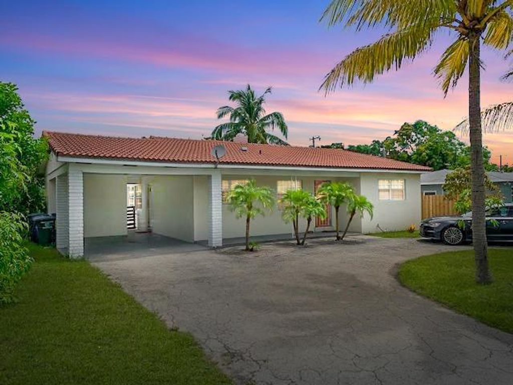 Photo of 639 Date Palm Drive, Lake Park, FL 33403 (MLS # R10677030)