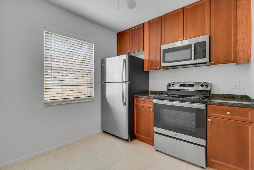 Photo of 1025 Lake Shore Drive #202, Lake Park, FL 33403 (MLS # R11128351)