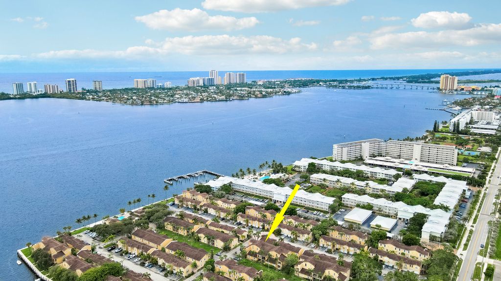 Photo of 1025 Lake Shore Drive #202, Lake Park, FL 33403 (MLS # R11128351)