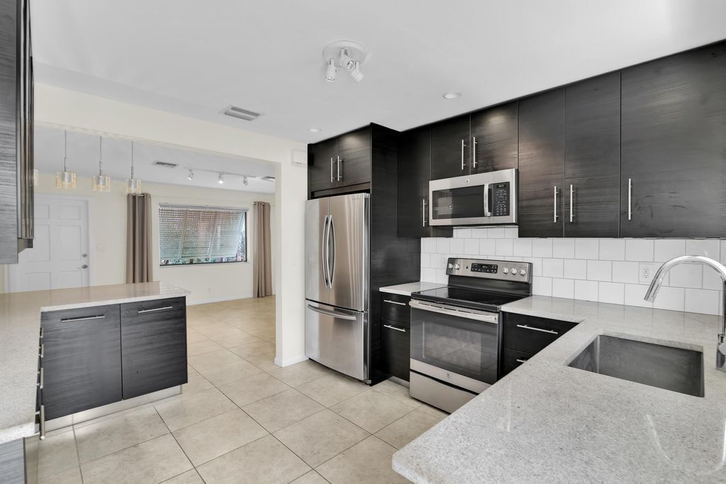 Photo of 320 NE 1st Avenue, Delray Beach, FL 33444 (MLS # B26024300)
