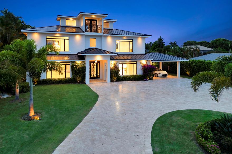 Remodeled and expanded in 2024, this elegant home offers 4,750 sq. ft. under air in a private gated community. Featuring 4 bedrooms, each with an en-suite bath and walk-in closet, plus 2 half baths and a third-floor office. The open floor plan highlights high ceilings, designer finishes, and a chef's kitchen with custom cabinetry, premium appliances, and quartzite countertops. A private courtyard pool with covered patio provides the perfect indoor/outdoor lifestyle. Additional features include a 2-car garage and 2-car carport. Ideally located near the marina, this home is perfect for boaters and just minutes from Jupiter's beaches, golf, and dining.