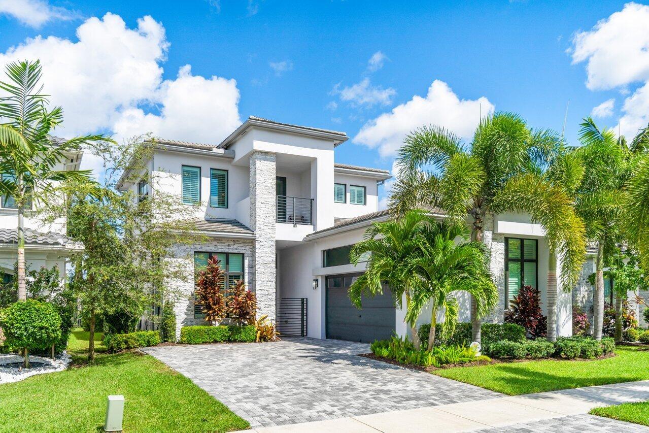 Welcome to this rarely available Vienna Grande Contemporary lakefront home located in Boca Bridges, one of Boca Raton's most desirable neighborhoods. At just under 3400 interior square feet this exquisite property features 4 bedrooms, 4 bathrooms, office/den, loft, 2 car garage and is the perfect blend of modern elegance and timeless charm. With its spacious rooms, luxurious finishes and convenient location, this home is the perfect way to experience the Florida Lifestyle. The open floor plan seamlessly connects the living room, dining area and kitchen creating a perfect space for entertaining guests or spending quality time with loved ones. The abundance of natural light floods the interior, creating a warm and inviting atmosphere. The kitchen is a true chef's delight,