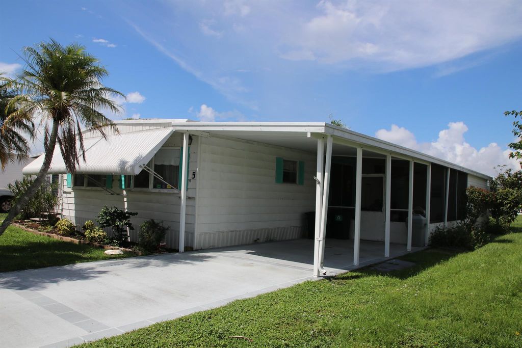 Photo of 5 SE Valencia Lane, Port Saint Lucie, FL 34952 (MLS # R11018139)