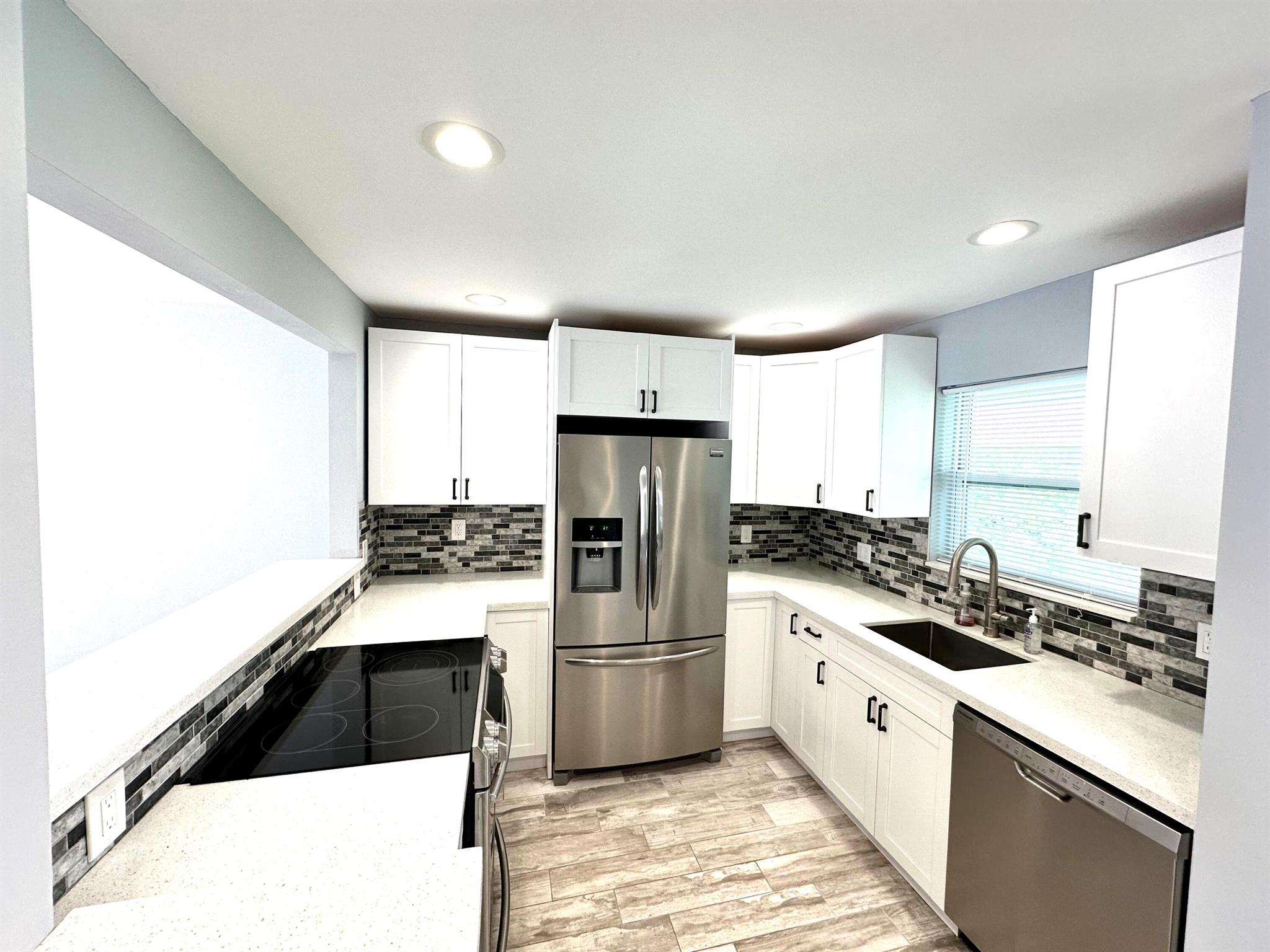Welcome to this updated 2 bedroom, 2 bath Co-Op! This contemporary space features a stylish open floor plan, a modern kitchen with custom cabinets, stainless steel appliances & quartz counters with breakfast bar. The corner unit provides ample natural light throughout, and relax on your private screened balcony. Conveniently located in desirable Lighthouse Point, just minutes to the beaches, I-95, Boca Raton and Fort Lauderdale. Unit features impact windows & front door, porcelain tile flooring throughout, new central AC & water heater, updated bathrooms, recessed lighting and fresh coat of paint. ***CASH ONLY*** No rentals allowed.