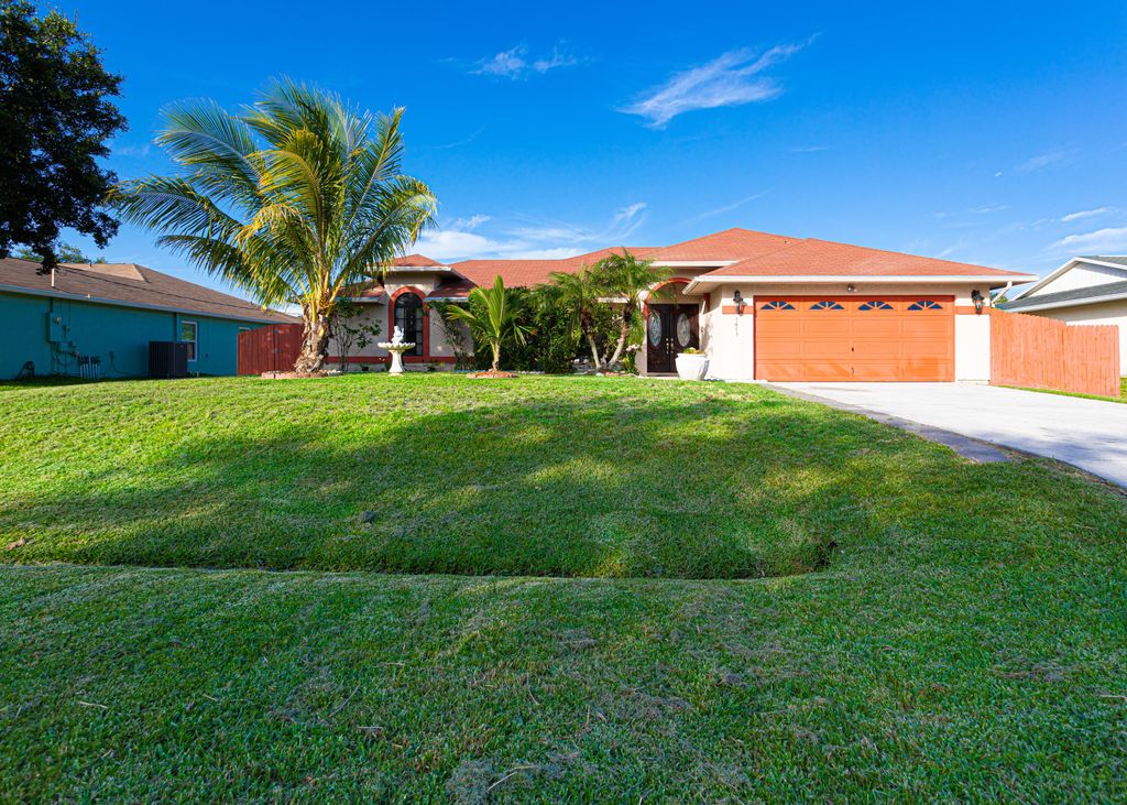 Photo of 1441 SE Barker Lane, Port Saint Lucie, FL 34983 (MLS # R10804418)