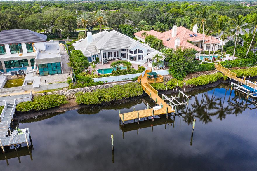 Great Opportunity - This waterfront estate home has 4 bedrooms, 3.5 car garage, open kitchen to family room, wet bar in living room, den/office with 1/2 bath.  Owners suite has a large sitting room, large bath and walk in closets.   Perfect  house for a renovation or a new build.