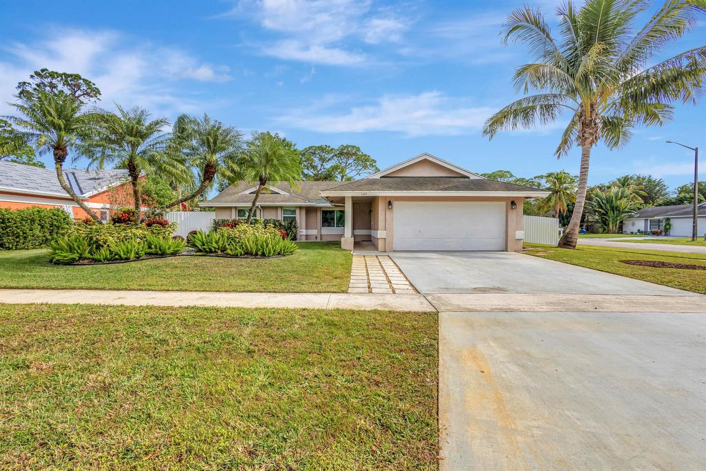Photo of 145 Parkwood Drive, Royal Palm Beach, FL 33411 (MLS # R10948516)