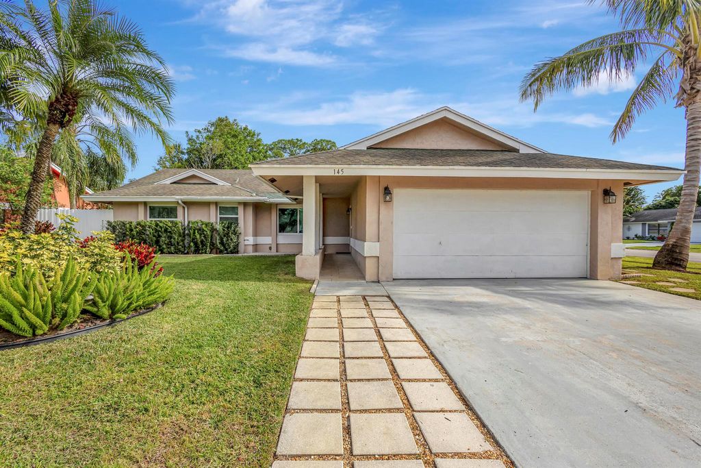 Photo of 145 Parkwood Drive, Royal Palm Beach, FL 33411 (MLS # R10948516)