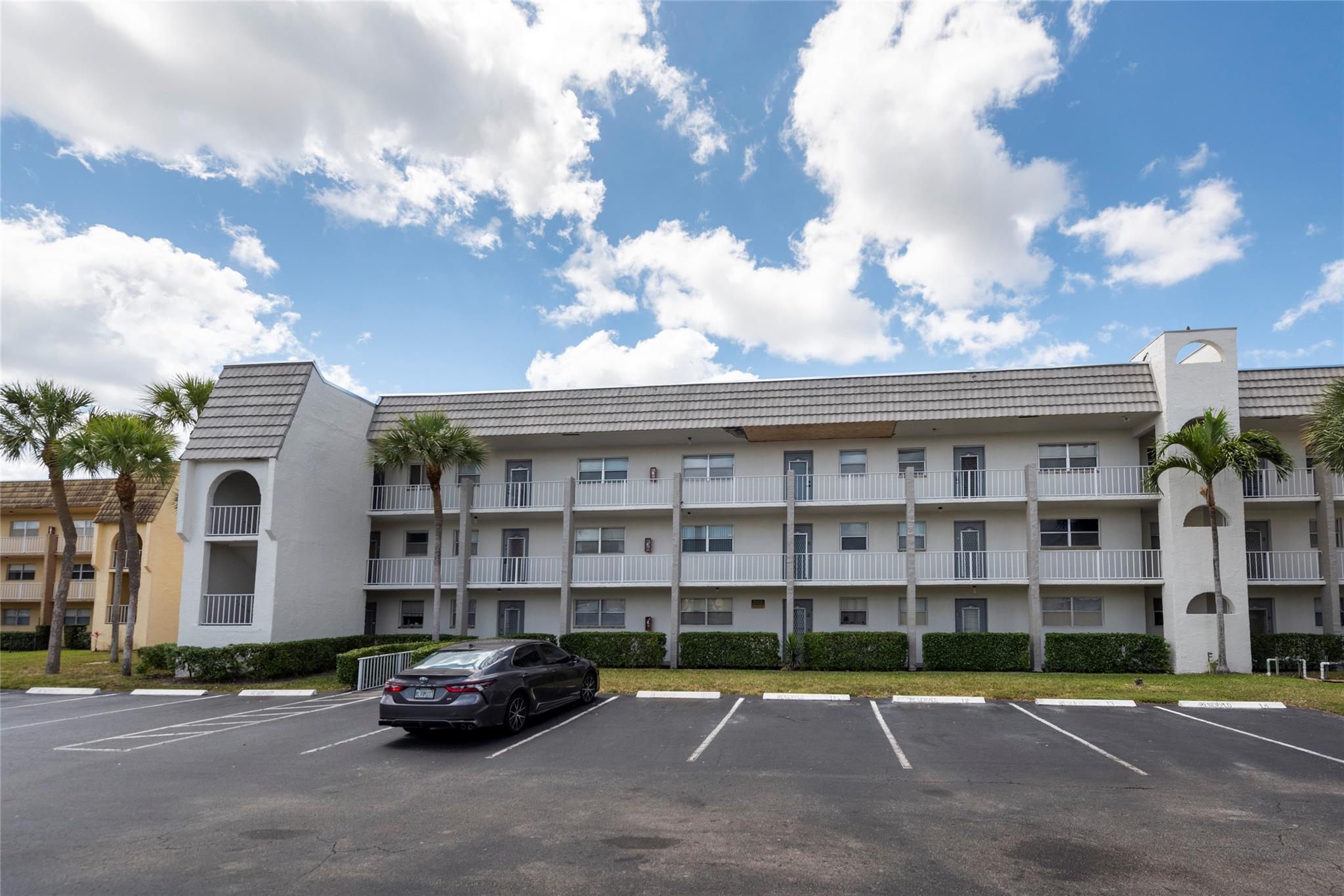 Reduced! Private corner 2/2 in desireable Sunrise Lakes Phase 2! This building boasts a new roof, fresh paint and is close to all transportation and active recreational facilities. Unit is nicely tiled thruout with white tile, full impact windows, kitchen has been opened for spacious feeling, enclosed patio adds additional room for morning coffee overlooking water view or can be used as TV area or office! Master bedroom is well-sized and features a big walk-in closet and shelves for more storage. 2nd bedroom has good sized close as well. Roof has been recently replaced and building has been painted as well. Maintenance includes all rec facilities including active clubhouse with great activities and events, includes water, basic cable, trash removal, and much more. Hurry Home!