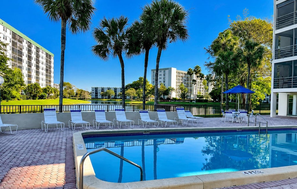 Photo of 2307 S Cypress Bend Drive #207a, Pompano Beach, FL 33069 (MLS # B26046611)