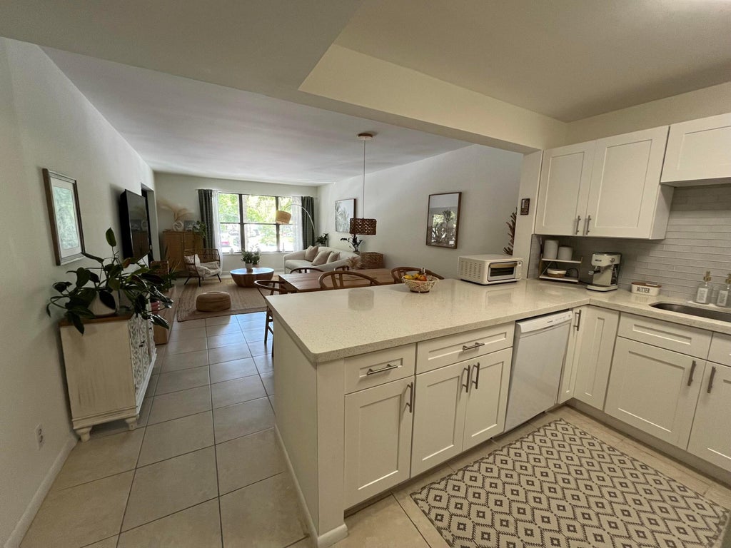 Photo of 2307 S Cypress Bend Drive #207a, Pompano Beach, FL 33069 (MLS # B26046611)