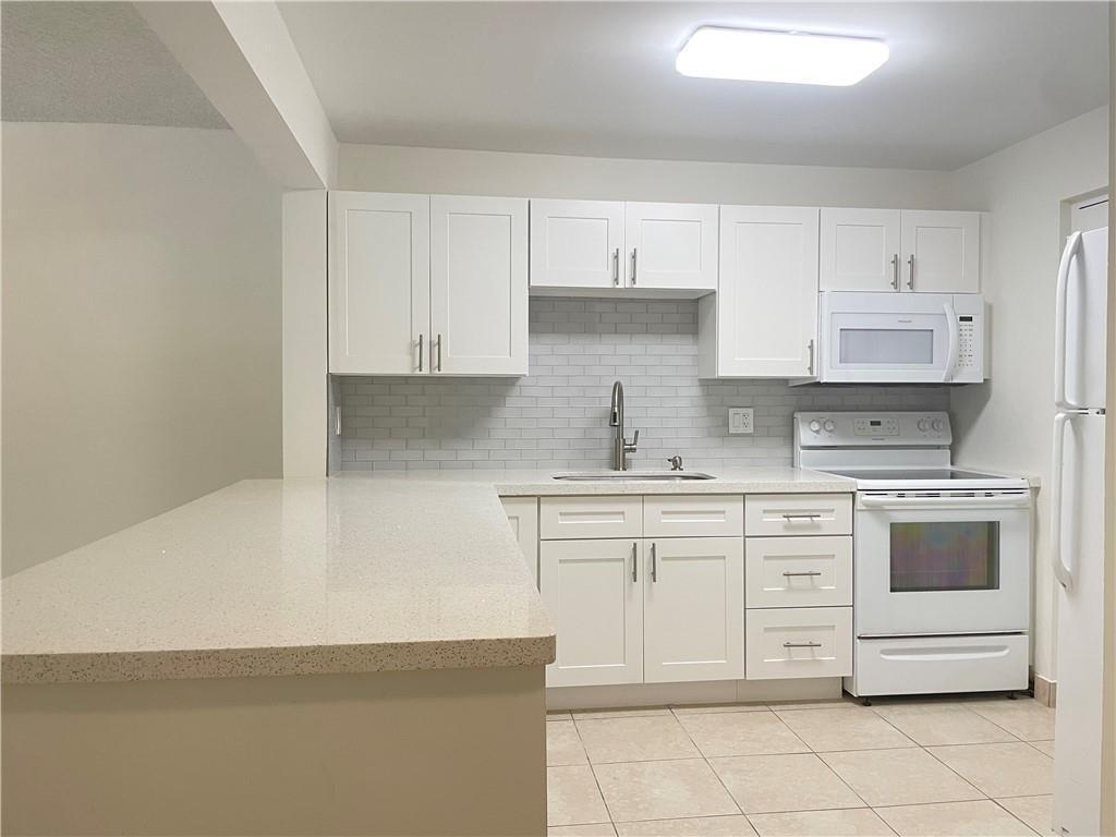 Photo of 2307 S Cypress Bend Drive #207a, Pompano Beach, FL 33069 (MLS # B26046611)