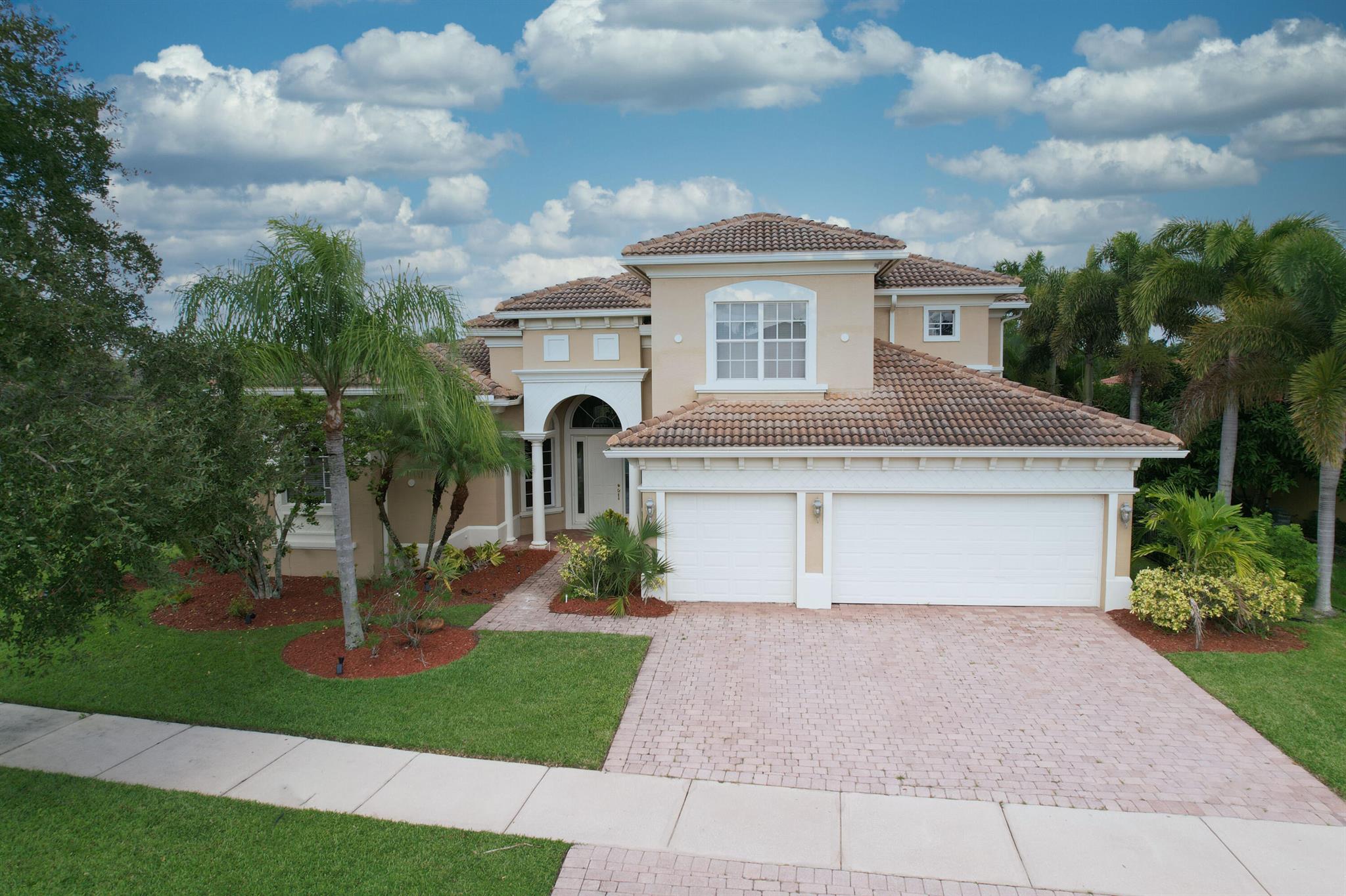 Plenty of room to roam! If you are looking for a beautiful spacious pool home with lots of bedrooms, and lots of bathrooms, we have found the perfect place for you, within an upscale gated community at Tradition.  New paint throughout the interior and recent paint on the exterior.  New flooring.  The primary bedroom suite on the ground floor has spacious his and her walk in closets.  Two more bedrooms, and two more baths are also on the ground floor.  The upstairs contains two bedrooms, and two more baths (one a mini suite).  Also included is an office/den.  The large patio area adjoining the pool is also plumbed for an outdoor kitchen.  Lots of Storage!Seller will entertain negotiation in which the prospective buyer may enter into a lease, for the subject property, for a 1