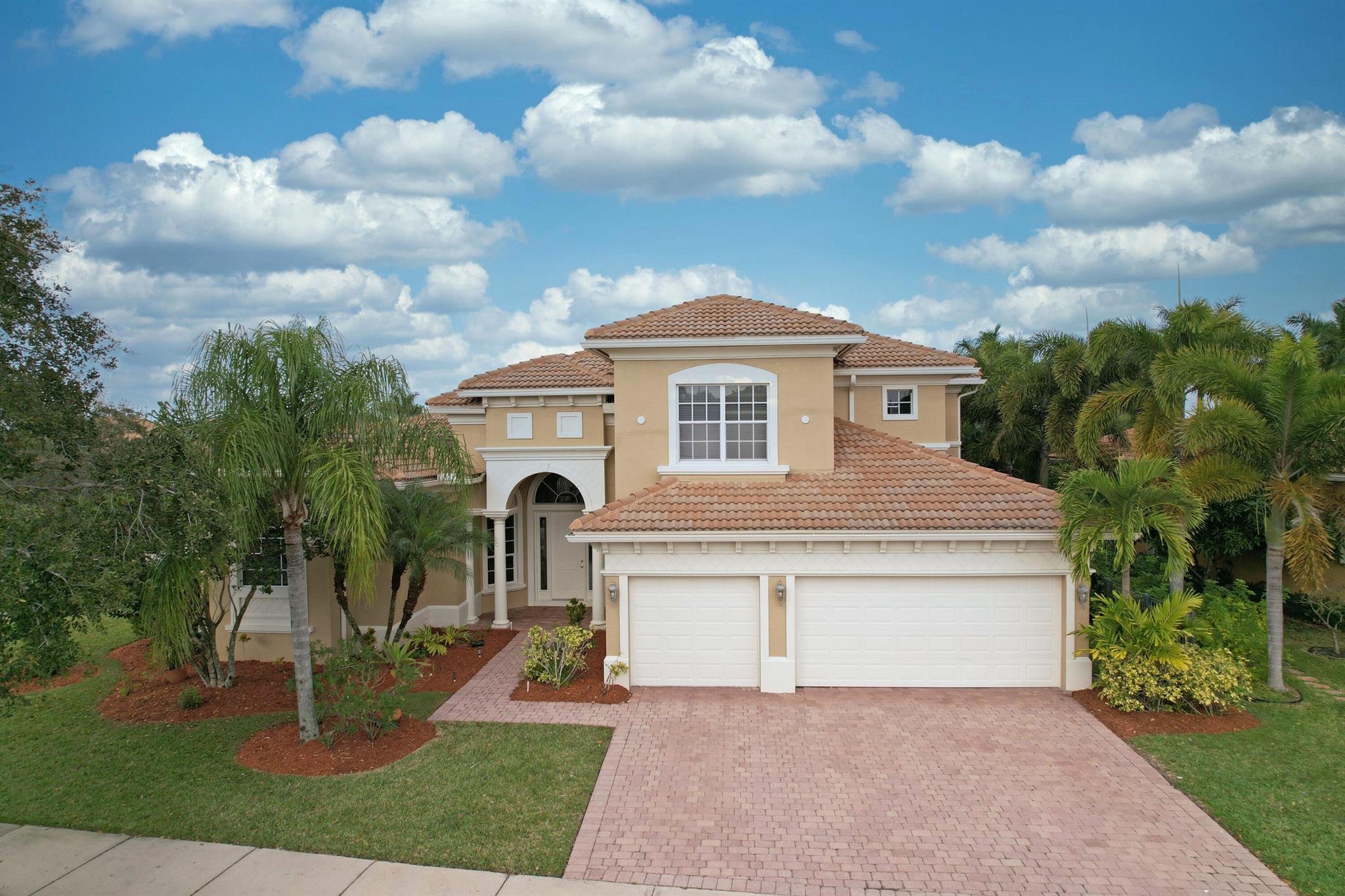Plenty of room to roam! If you are looking for a beautiful spacious pool home with lots of bedrooms, and lots of bathrooms, we have found the perfect place for you, within an upscale gated community at Tradition. New paint throughout the interior and recent paint on the exterior. New flooring. The primary bedroom suite on the ground floor has spacious his and her walk in closets. Two more bedrooms, and two more baths are also on the ground floor. The upstairs contains two bedrooms, and two more baths (one a mini suite). Also included is an office/den. The large patio area adjoining the pool is also plumbed for an outdoor kitchen. Extensive storage space. Come see it today and make it your own!