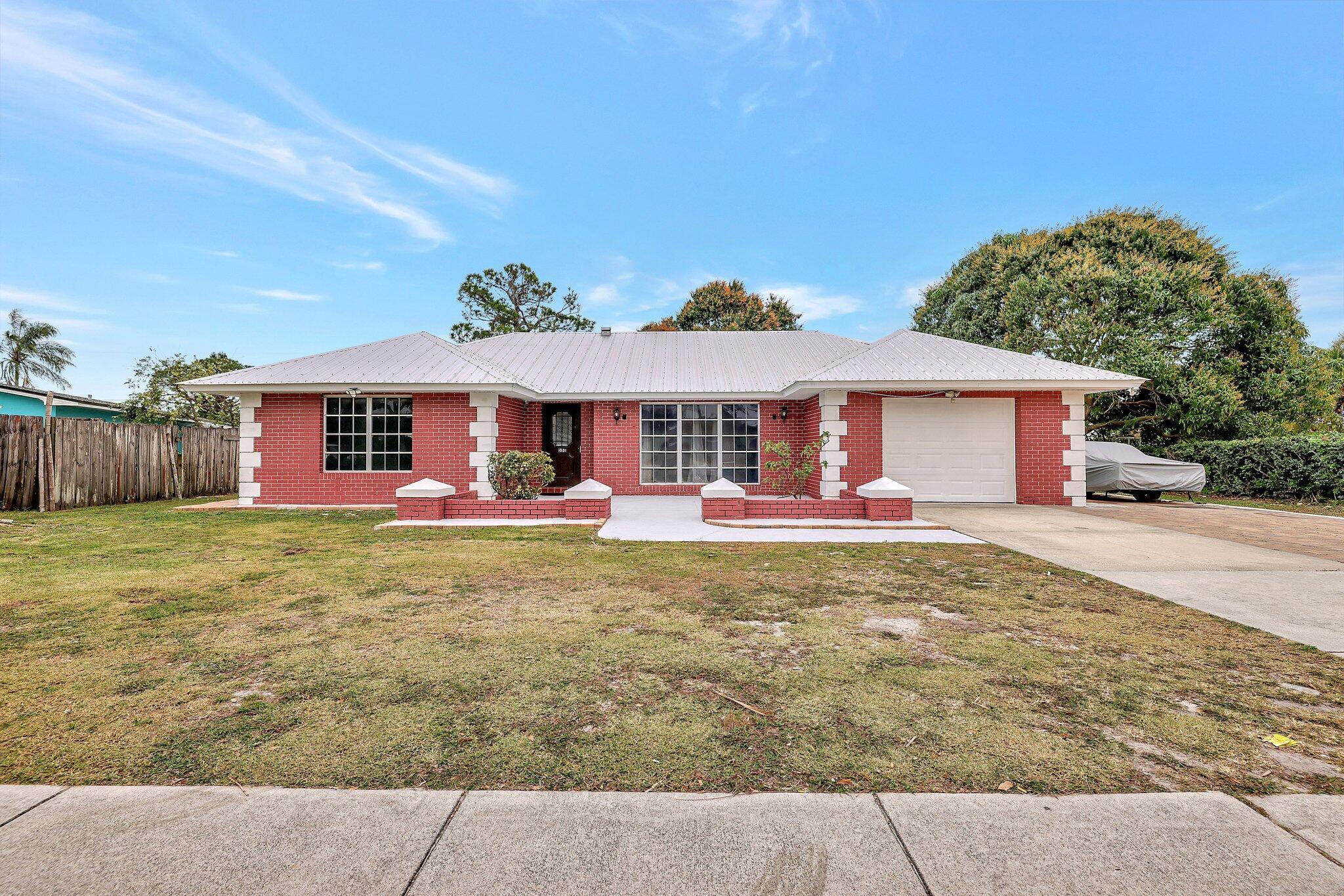 Discover your new 3/2/1 home at 388 E Prima Vista Blvd, Port St. Lucie, FL 34953--a nicely updated single-family residence now available for rent. This charming property offers a spacious and sunlit layout, perfect for families or professionals seeking comfort and style. The remodeled kitchen is a standout feature, equipped with a gas stove, sleek cabinetry, modern appliances, a convenient breakfast bar, and a reverse osmosis water filtration system for pure, clean water. Each bedroom is thoughtfully designed with generous closet space, ensuring plenty of room for storage and relaxation. Step outside to enjoy a large backyard--ideal for entertaining guests, unwinding after a long day, or letting kids play freely.