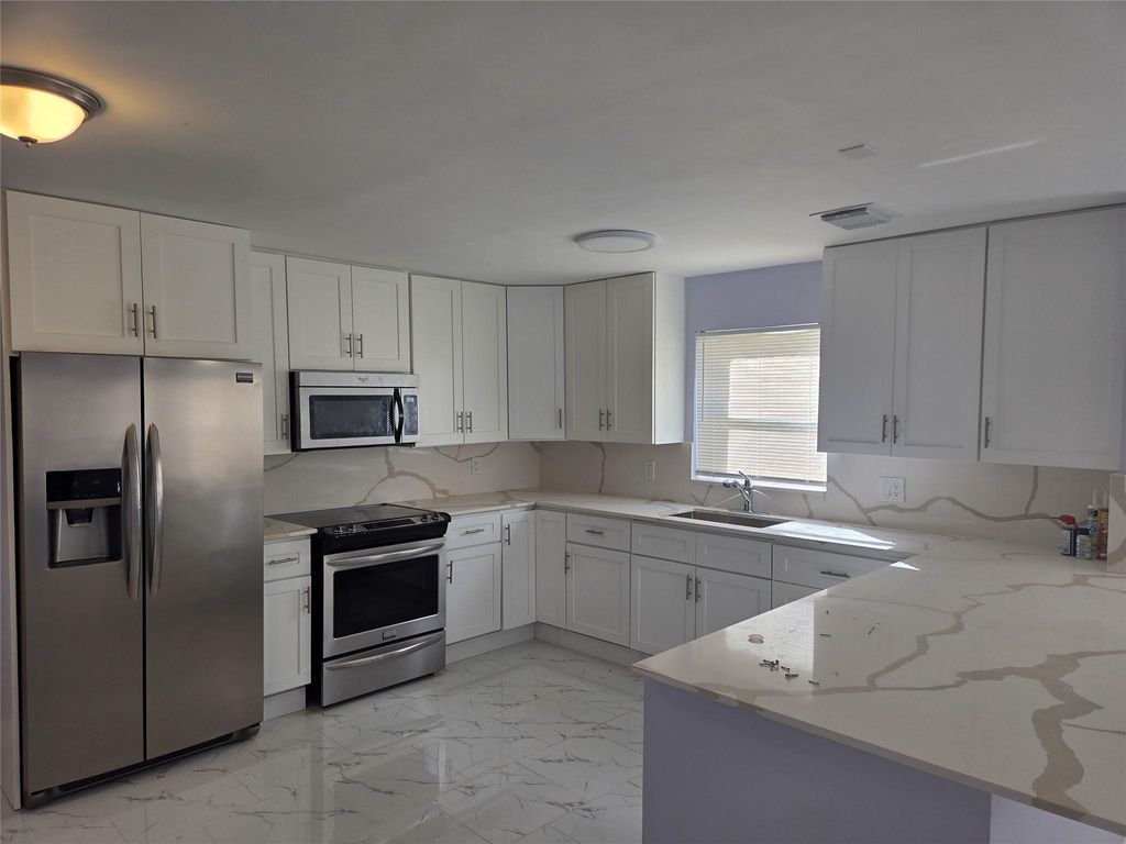 Photo of 7925 SW 9th St #7925, North Lauderdale, FL 33068 (MLS # F10538229)