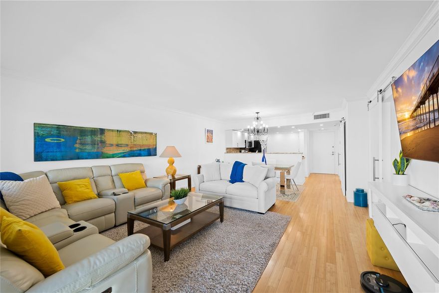 One-of-a-kind, turnkey beachfront condo in the highly desirable Sea Ranch Club. Fully renovated and thoughtfully redesigned, this spacious residence features a large primary suite, added den, and two full bathrooms. The open kitchen with granite countertops, stainless steel appliances, and recessed lighting is perfect for entertaining. Light engineered wood flooring throughout, Primary bath offers double sinks & a modern jacuzzi tub/shower combo. Enjoy spectacular ocean views from the balcony. Impact windows and doors throughout. Additional highlights include a full-size washer/dryer and extra storage. Sea Ranch Club offers resort-style living with three pools, two gyms, tennis courts, 2 dog parks, cabanas, herb gardens, and direct beach access. Walking distance to Publix, shops & more.