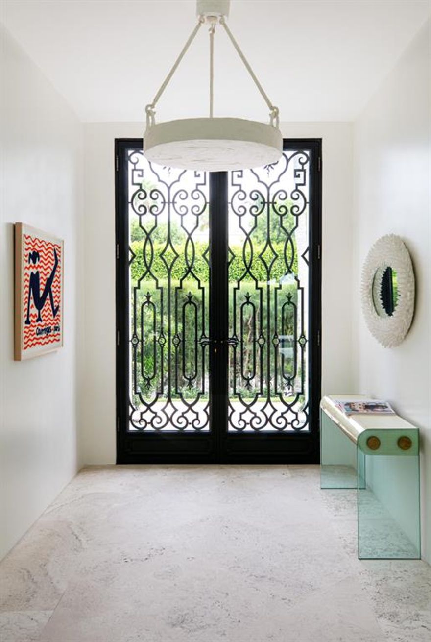 A formal Gottfried Regency reinvented by designer, Lisa Perry for today's modern lifestyle.  Completely renovated to code, Lisa opened the entire house bringing the inside out, creating a seamless living and entertaining space.  

Furnished with her vibrant sense of style and color, the house is being sold with all the furniture, art and accessories.  It is ready for immediate occupancy.