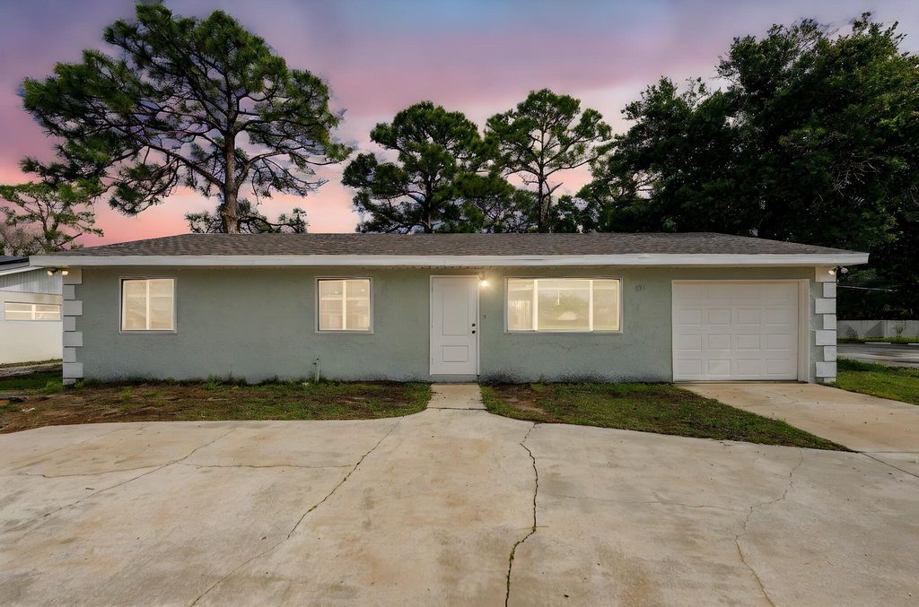 Photo of 651 SE Port St Lucie Boulevard, Port Saint Lucie, FL 34984 (MLS # B26013854)