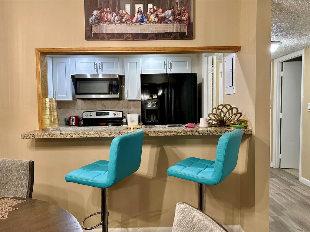 Photo of 4156 Inverrary Drive #205, Lauderhill, FL 33319 (MLS # B26038737)