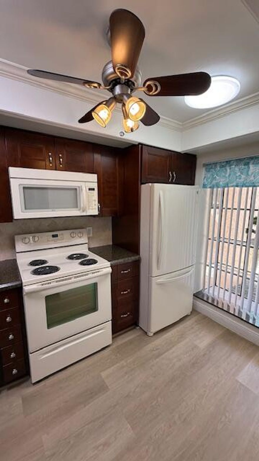 This is a must see and very well-priced, 1st floor, 3BR/2BA (currently being used as a 2/2 with a spacious open den which can easily be converted back in to a bedroom) and an in-unit washer/dryer. Best of all the parking space is very convenient and only a few steps from the front door in space #346. The master bedroom is spacious and features a large walk-in closet. The condo has an updated kitchen and baths, and newer plush carpet in the bedrooms. The community is a short drive to amazing beaches, shopping, grocery stores, dining, and major highways. The screened in patio overlooks a lush and tropical garden and also features a large and private storage room.