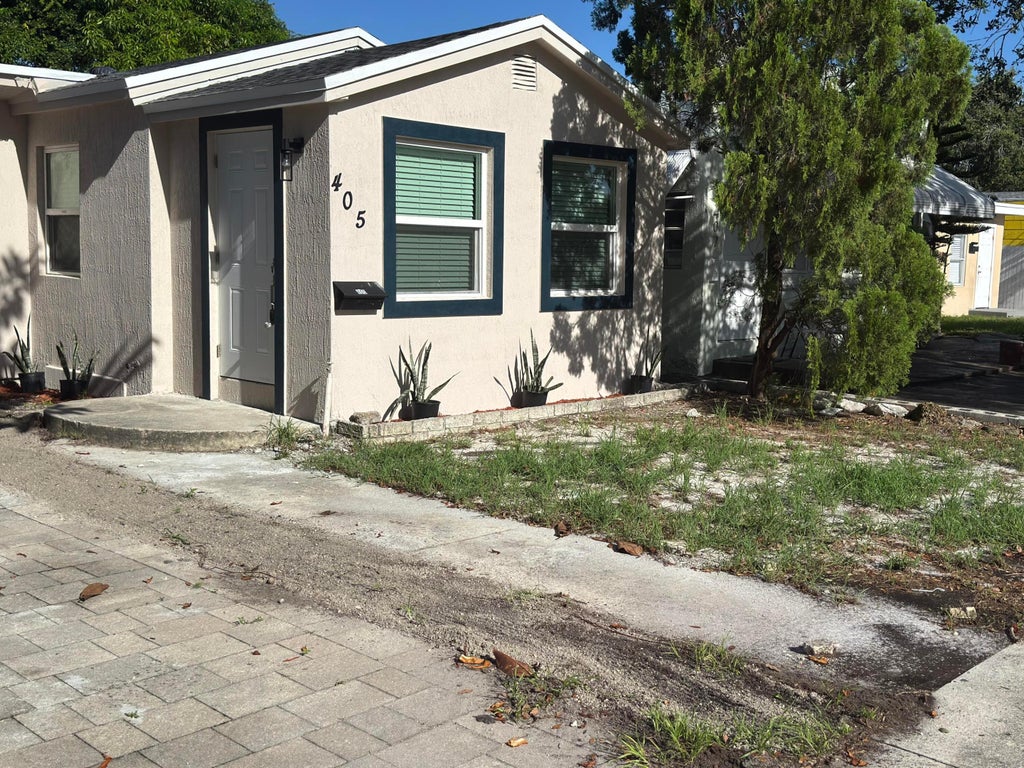 Photo of 405 N E Street, Lake Worth, FL 33460 (MLS # B26064935)