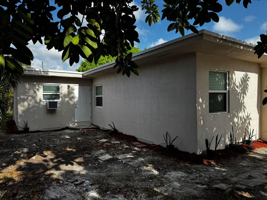 Photo of 405 N E Street, Lake Worth, FL 33460 (MLS # B26064935)