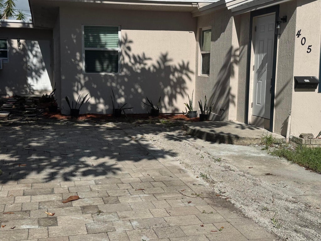 Photo of 405 N E Street, Lake Worth, FL 33460 (MLS # B26064935)