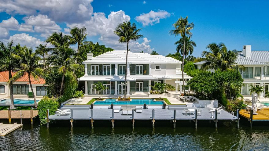 A rare beauty in Sunrise Key. Stunning transitional-style estate offering the opportunity to live within a work of art. Spectacular views and interiors enveloped in the floor-to-ceiling glass, the well-conceived floor plan was designed to optimize water views from almost every vantage point. The Rio Barcelona vista is endless. Recently refreshed pool and landscaping brought this amazing setting to another level of tropical paradise.
Preferred southern exposure offering a seamless layout, the formal dining room, just adjacent to the living room and the gourmet Modern Poggenphol kitchen. All bedrooms en-suite, and upstairs with a separate guest suite. Master bedroom suite encompasses a sitting area, separate dressing area, and spa like bathroom. Available for rent at $37,750/month.