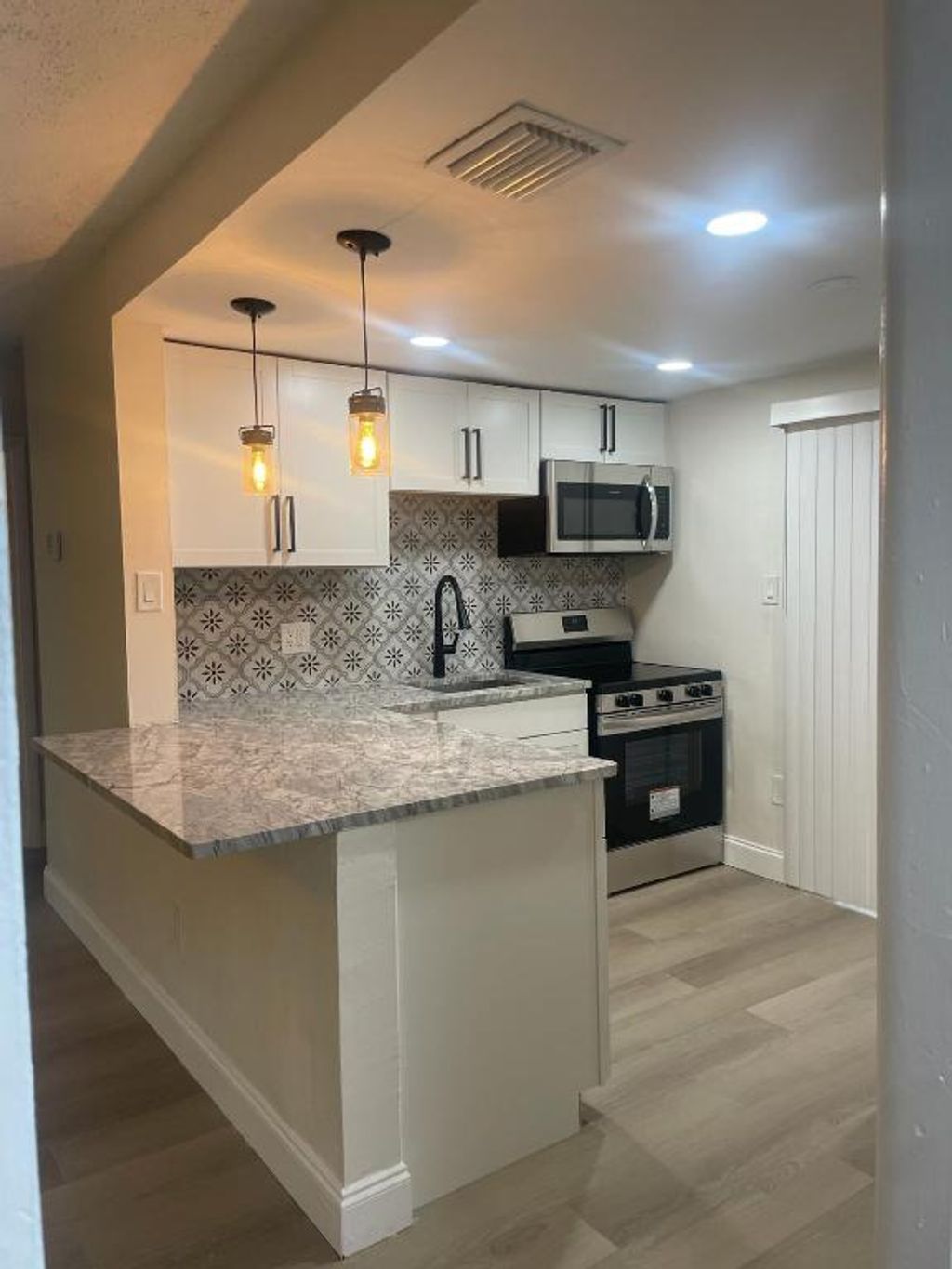 Photo of 4696 Clinton Boulevard, Lake Worth, FL 33463 (MLS # R10966891)