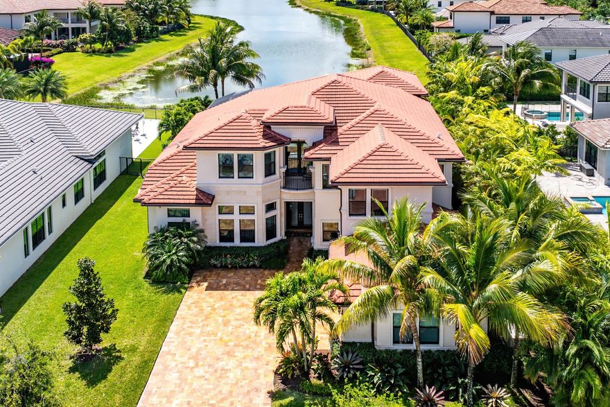 Exquisitely decorated by Decorators Unlimited, this highly coveted Colonnade Grande floor plan is perfectly perched at the head of a long lake in Seven Bridges. This home showcases over $700,000 of extensive customization inclusive of luxurious marble and wood flooring, built-in home office, custom media room, designer light fixtures and window treatments, a full house generator and a sprawling one of a kind game room. The backyard oasis is fully screened and hosts a completely customized heated salt water pool with spa. Luxury living is redefined at Seven Bridges where residents have access to world class amenities including a gourmet restaurant, 3 pools, elite tennis program and fitness classes. Pickleball coming soon.