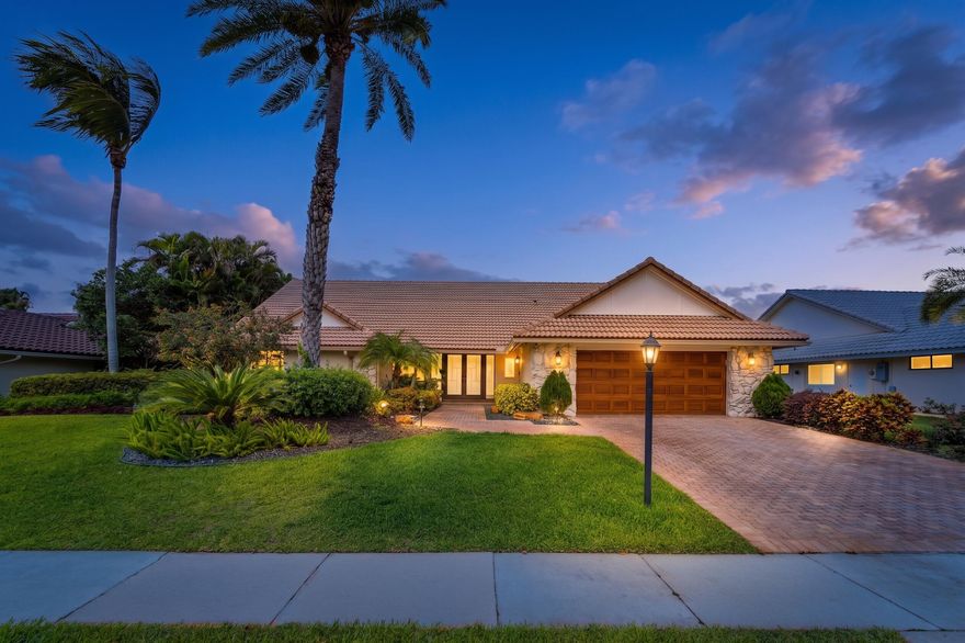 Perfectly situated on a private, tranquil lot just a short walk to the clubhouse, this inviting residence is located in the award-winning Delaire Country Club and offers the ideal blend of comfort, style, and lifestyle. From the moment you enter, you are welcomed by a striking handsome wood cathedral ceiling that enhances the open-concept design and fills the home with warmth, scale, and architectural character. The interior features updated flooring and a newer kitchen, thoughtfully designed with an oversized island, stainless steel appliances, and a bright eat-in area that flows seamlessly into the main living spaces—ideal for both relaxed everyday living and entertaining. A convenient laundry area further enhances functionality.  The home offers three graciously proportioned bedrooms,  including a spacious primary suite that overlooks the pool and serves as a true private retreat. The primary bedroom features the rare and highly desirable benefit of two separate bathrooms, offering exceptional privacy and comfort. In total, the home includes three full bathrooms and two half baths, one of which serves as a convenient cabana bath for poolside living. Step outside to a lush, tropical backyard oasis, complete with a covered lanai and sparkling pool, creating a serene and private setting for relaxation or entertaining. The outdoor space captures the essence of South Florida living with its inviting, resort-like atmosphere. Additional highlights include a two-car garage plus a separate golf cart garage, impact windows for worry-free summers, and the added advantage of natural gas available on the street. Located in Delaire Country Club, residents enjoy a boutique-style private community offering a championship golf course, newly renovated clubhouse, fitness center, tennis, pickleball, and an active social lifestyle—all within a beautifully maintained and intimate setting. Delaire Country Club is not just a residence, but a private boutique country club, where 324 custom homes surround a 27-hole championship golf course that requires no tee time. The clubhouse itself is a work of art, featuring a state-of-the-art 16,000 sq ft fitness center, outstanding culinary cuisine, a resort-style pool area, and 8 Har-Tru tennis courts plus 4 pickleball courts. Enjoy the generous extended family policy that Delaire offers, ensuring that you and your loved ones can fully embrace the country club lifestyle.