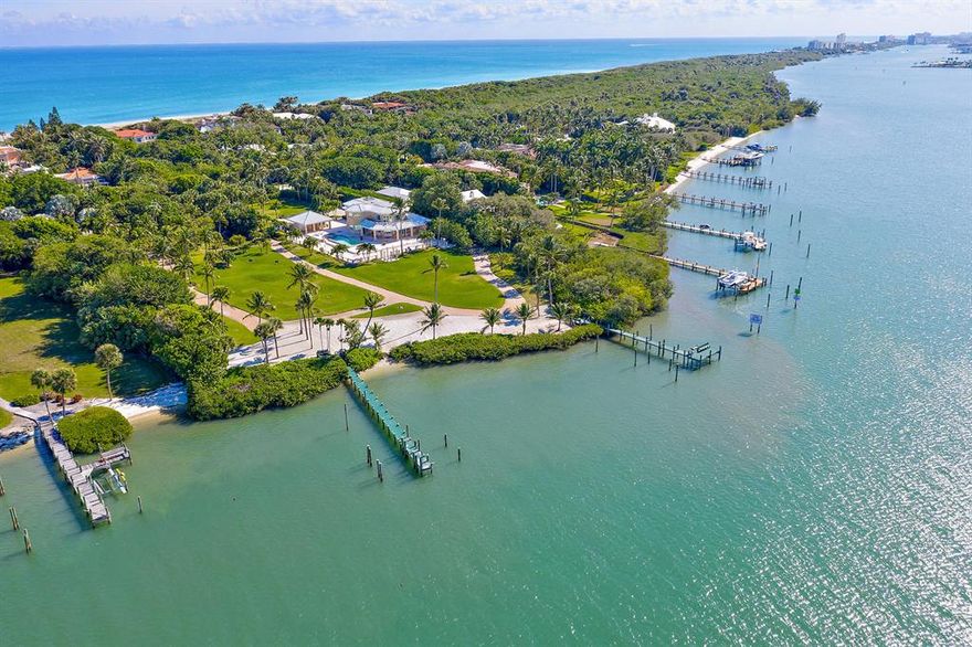 Exclusively available for the first time, this magnificent Jupiter Island double-lot spans 324 feet along the blue waters of the Intracoastal and stretches out over 3.2 acres. This is the largest Intracoastal lot available on prestigious Jupiter Island, making this truly a rare find. Currently deeded as two separate lots with two boat docks, and anchored by a four-bedroom guest house, this unique property affords intriguing opportunities. Occupy the immaculate guest house, while realizing the property's full potential. This is the last opportunity to design a truly grand private family enclave on the turquoise Intracoastal with a total allowable floor area of over 14,000 sf including two accessory buildings. Or develop two private residences, each with a total allowable floor area of over 9,000 sf including their own two accessory buildings, afforded by the separately deeded lots. See renderings for one home on one of the two lots. Lush landscaping and mature perimeter planting already exists providing seclusion and privacy. The sought-after location on the southern end of the Island allows for convenient access to restaurants, shops, airports and some of the area's finest golf courses. With the Jupiter Inlet in close proximity, with world class fishing only minutes away and the Bahamas only 55 miles off-shore, take advantage of the two deep water docks located within a desirable no-wake zone, providing ample room for yachts, sport fishing boats and other toys. Launch paddle boards and kayaks from your sandy shoreline. Peace and solitude exude from this exclusive private oasis, offering the most stunning Florida sunsets over the Intracoastal.