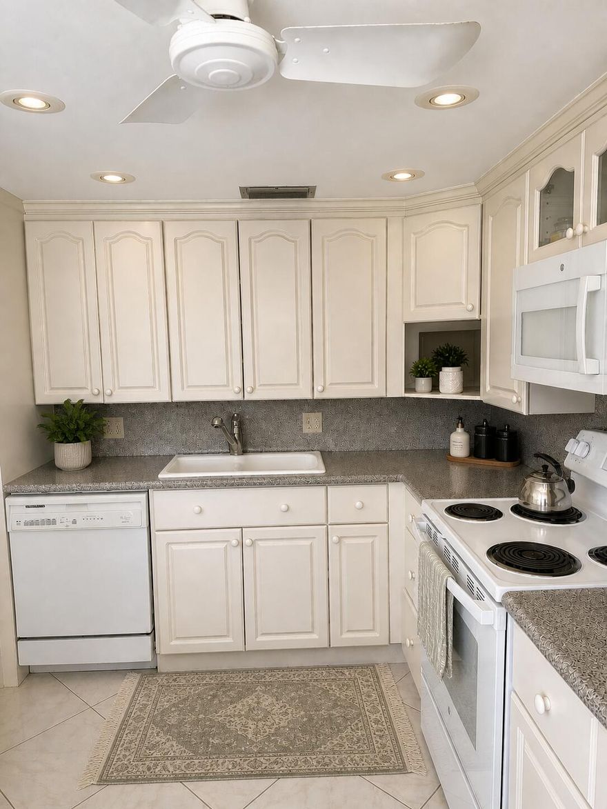 SPACIOUS PENTHOUSE CORNER FEATURING AN OVERSIZED 2 BEDROOM 2 BATH SPLIT FLOOR PLAN WITH SERENE LAKE VIEWS. LOCATED IN A VIBRANT 55+ COMMUNITY.