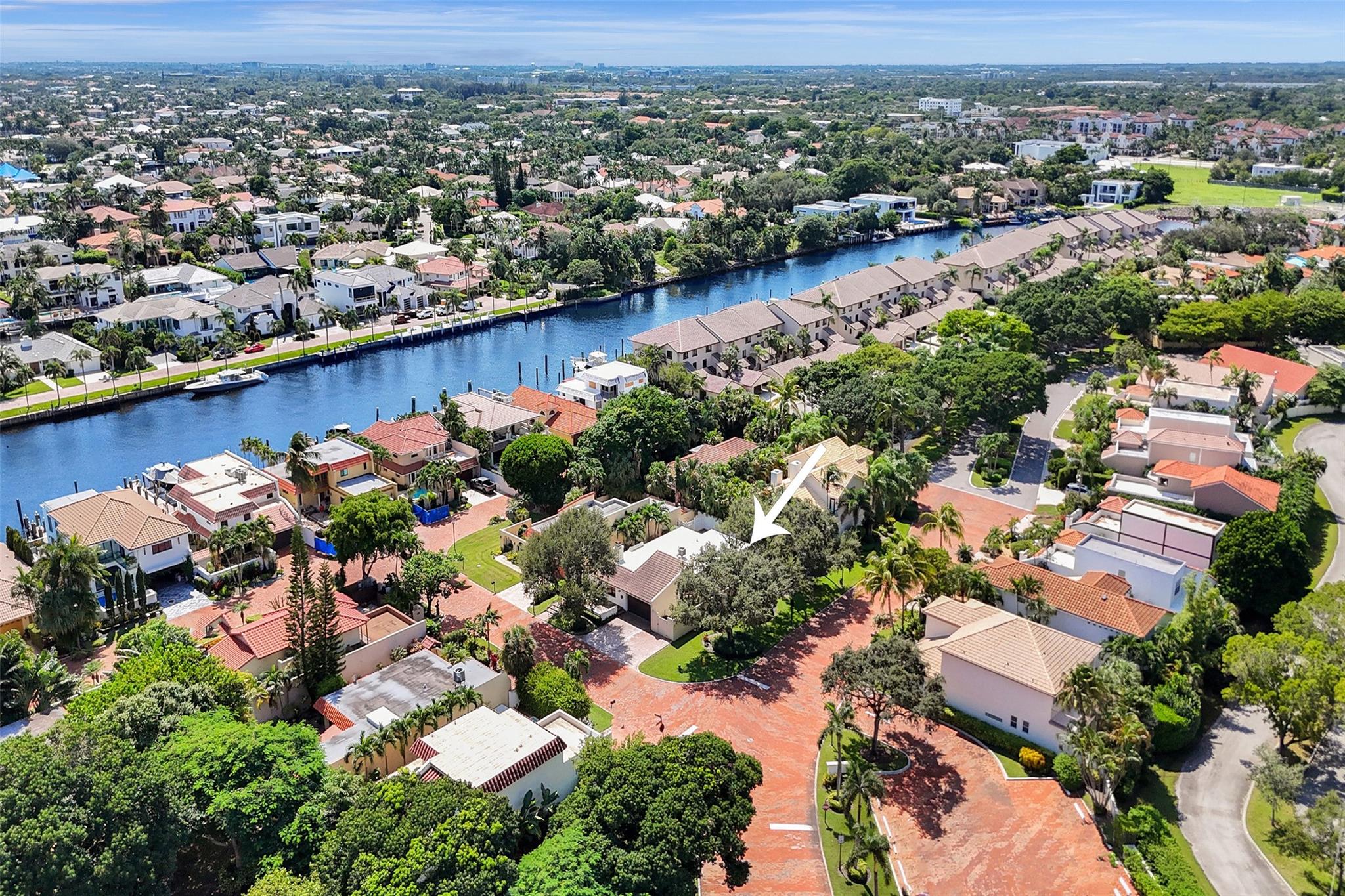 Charming 2BR + Office, 2BA single-family home with a private pool, nestled in the prestigious 24-hour guard-gated waterfront community of Pelican Harbor. Ideally located across from the Clubhouse, featuring a pool, gym, and waterfront deck. This community also boasts a second pool, lighted tennis/pickleball courts, and available boat docks for rent or sale. The master suite and spacious kitchen open directly to the pool area, perfect for entertaining. Includes a separate den/home office and a 2-car garage. partial impact windows. Just minutes from the beach and downtown Atlantic Avenue’s restaurants and shops. All ages welcome, pet-friendly.
