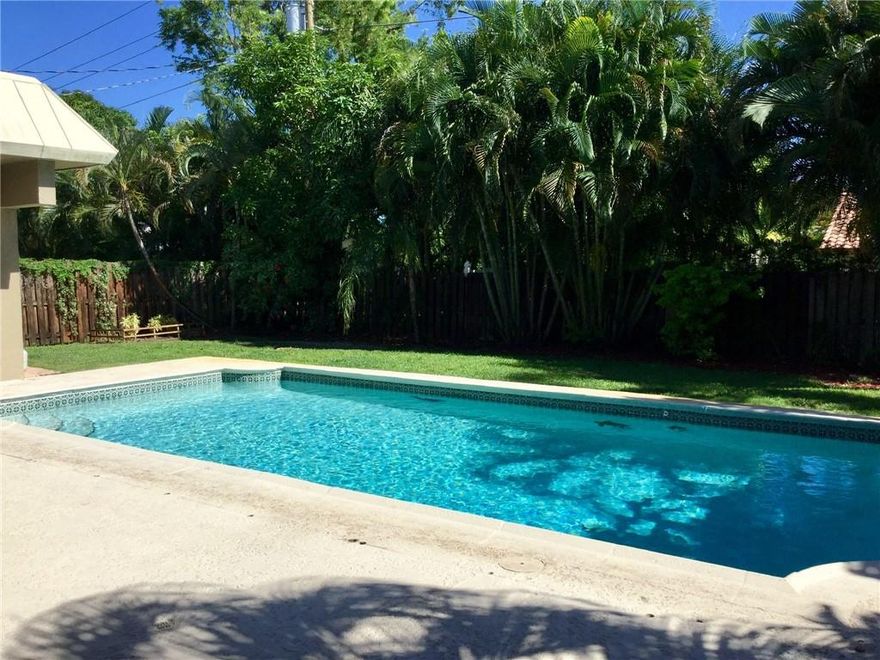 SELLER WANTS IT SOLD! East Boca Raton pool home with A rated schools! Newer roof-2022, four large bedrooms, two bathrooms and located in beautiful Palm Beach Farms.  Split floor-plan, with a spacious master bedroom & stone/marble master bath suite.  Open kitchen with stainless steel appliances, granite, wood cabinets, tile floors in main living areas and wood-like flooring in the bedrooms.  4th bedroom can be utilized as a den, which is located just off the pool and the garage was converted to a 5th bedroom and can be easily converted back, plenty of options.  Spacious backyard with an amazing pool to enjoy for the whole family.  You can make this home your own and investor friendly.  City parks within walking distance and a brand new waterfront park with pickle-ball courts.