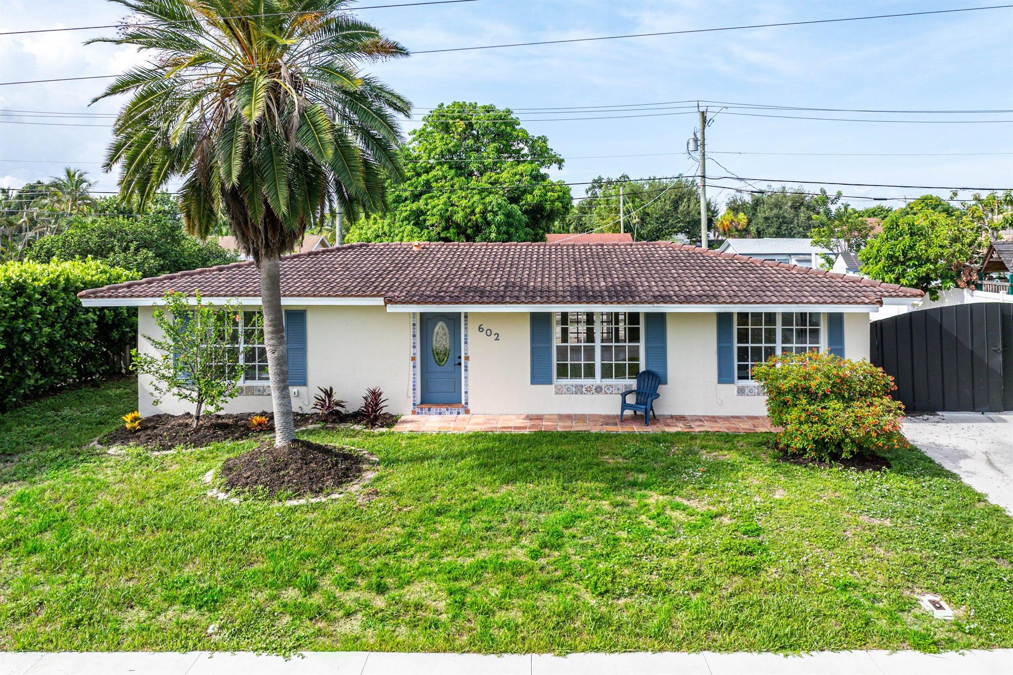 Welcome to your move in ready oasis in the sought-after Tropic Palms community of East Delray Beach! This stunning single-family home offers the perfect blend of modern luxury and coastal charm, boasting brand new custom kitchen cabinetry, quartz countertops, and new stove! Freshly painted throughout, step inside to your open-concept layout, ideal for entertaining friends and family. The spacious living area is bathed in natural light, creating a warm and inviting ambiance. Enjoy sunny afternoons lounging on the patio or gardening in your private sanctuary. SCREENED LANAI & LAUNDRY/UTILITY ROOM.HUGE FENCED IN BACKYARD BIG ENOUGH FOR A GARDEN, POOL + RV/BOAT STORAGE-PLUS LARGE DRIVEWAY!