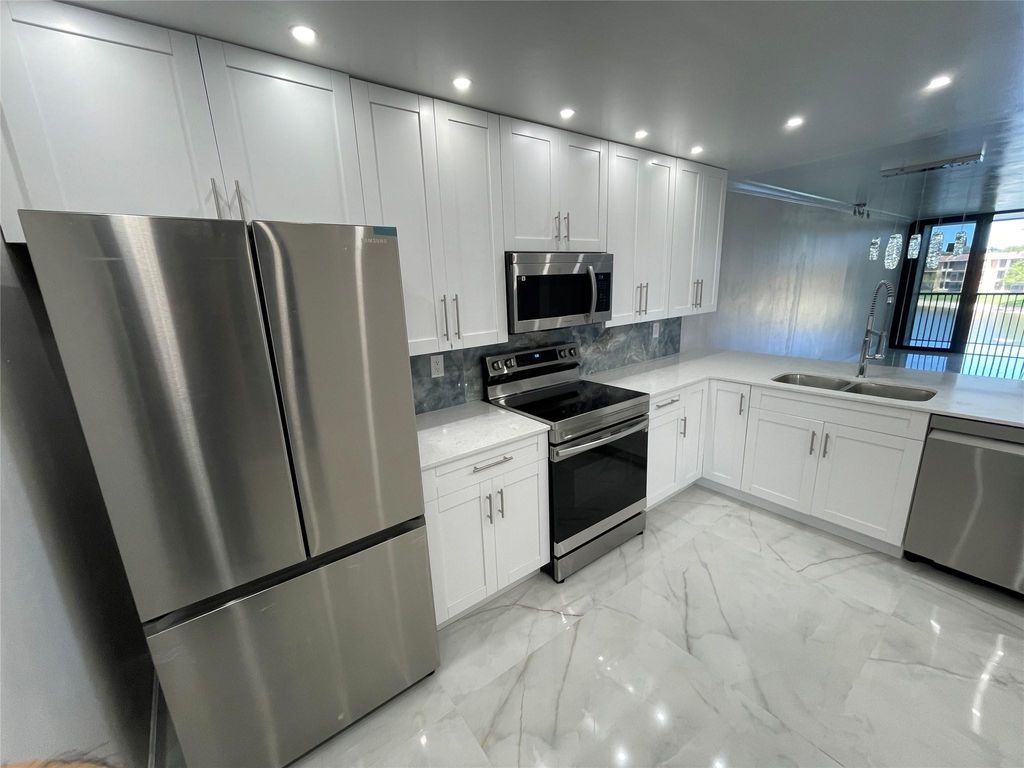 Photo of 6530 Coral Lake Drive #306, Margate, FL 33063 (MLS # B26022773)