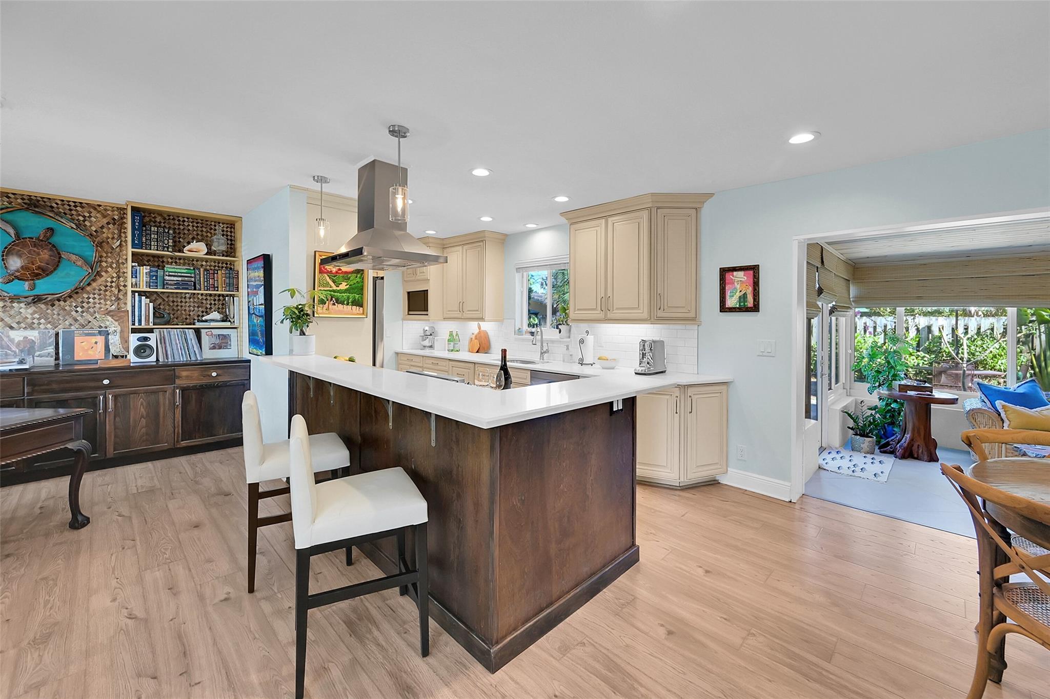 Priced to sell and walk to the beach! This updated tropical retreat has new central A/C (2024), premium metal roof (2023), and ALL impact windows. Bathed in natural light, the open layout features a renovated kitchen with stainless appliances, quartz counters, and tons of storage! Bring your Toys! No HOA and an oversized driveway means parking for your boat or RV. Located on one of the most desirable streets in Harbor Village, it is one block from the water and it has a larger lot - plenty of room to build a pool and additions! The garage can be easily converted to a 3rd bedroom. Boat ramp, Publix, great restaurants, pickleball, golf, aquatic center, and the beach are all within 1.5 miles. Furniture is negotiable to make for an easy move-in or use immediately as a rental investment.