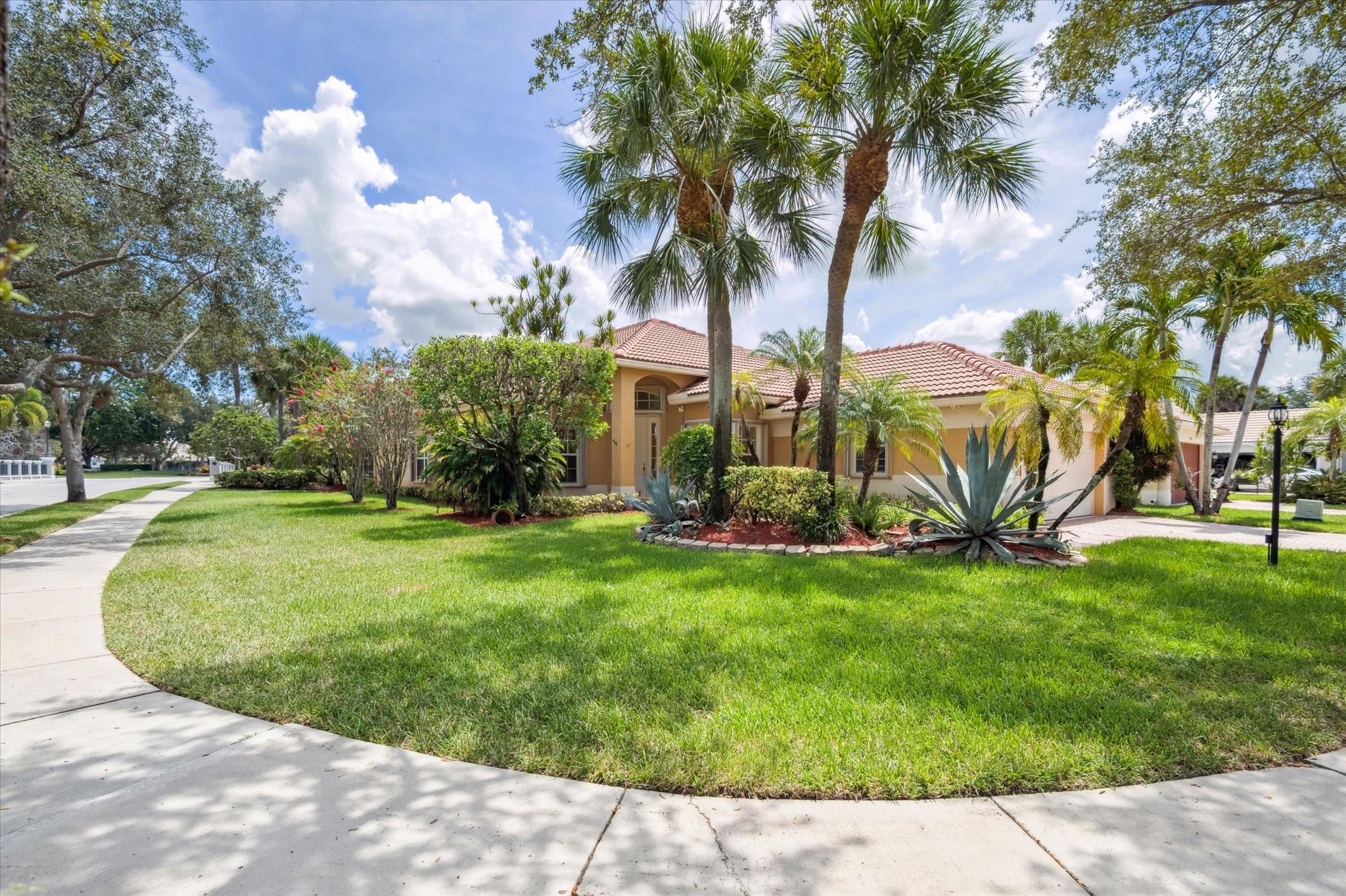 Welcome to Parkland Isles! This 4-bedroom, 2-bath Tavernier model is situated on a desirable corner lot with peaceful water views in a prestigious guard-gated community. The home features a 2-car garage, 2024 A/C, 2023 water heater, accordion hurricane shutters, and a large screened patio perfect for outdoor enjoyment.
The kitchen includes 42" cabinets, Corian countertops, and under-cabinet lighting, while custom closets add functionality throughout the home. Residents enjoy resort-style amenities including a clubhouse, fitness center, tennis and pickleball courts, and a heated pool and spa.
A rare opportunity in one of Parkland’s most sought-after neighborhoods—don’t miss it!