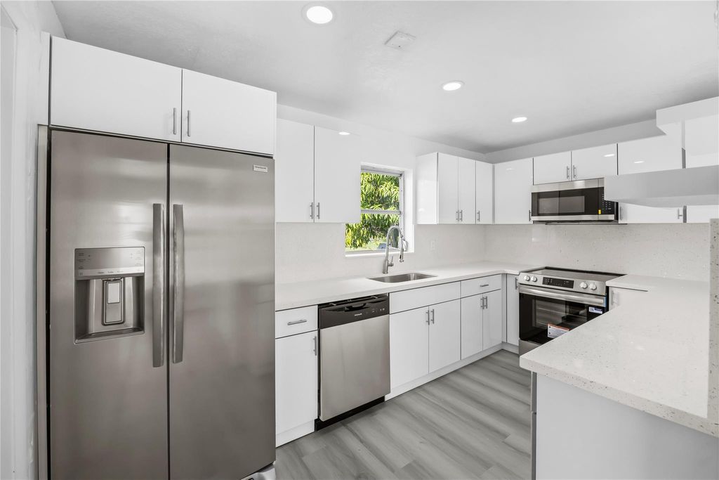 Photo of 1380 W 31st Street, Riviera Beach, FL 33404 (MLS # F10542335)