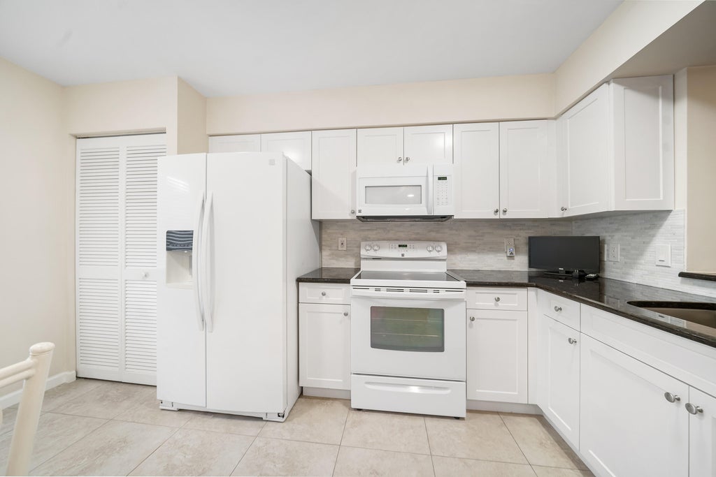 Photo of 6037 Pointe Regal Circle #304, Delray Beach, FL 33484 (MLS # R10938486)