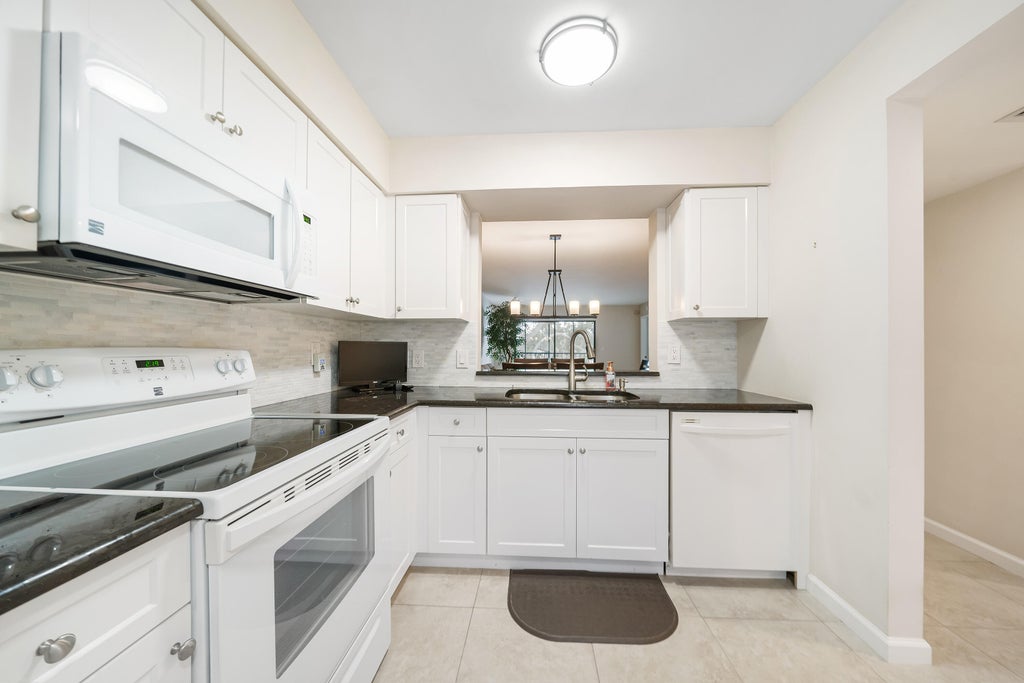 Photo of 6037 Pointe Regal Circle #304, Delray Beach, FL 33484 (MLS # R10938486)