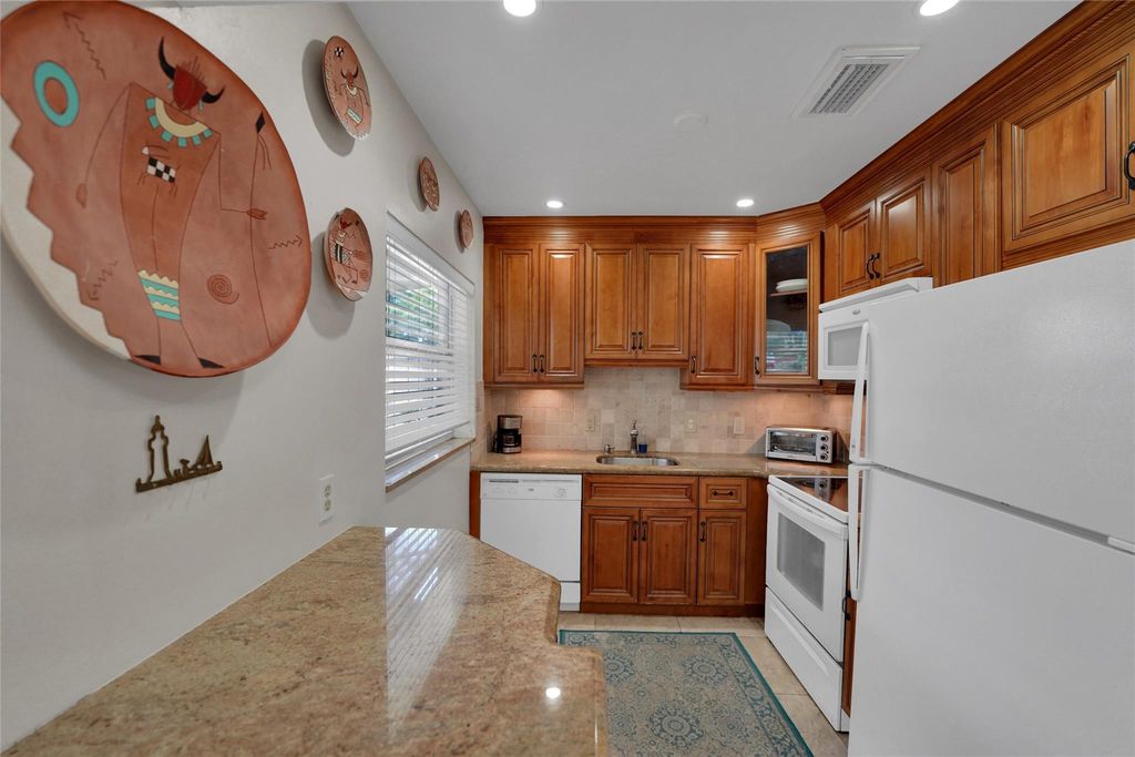 Photo of 2617 SW Natura Ave, Deerfield Beach, FL 33441 (MLS # F10531639)