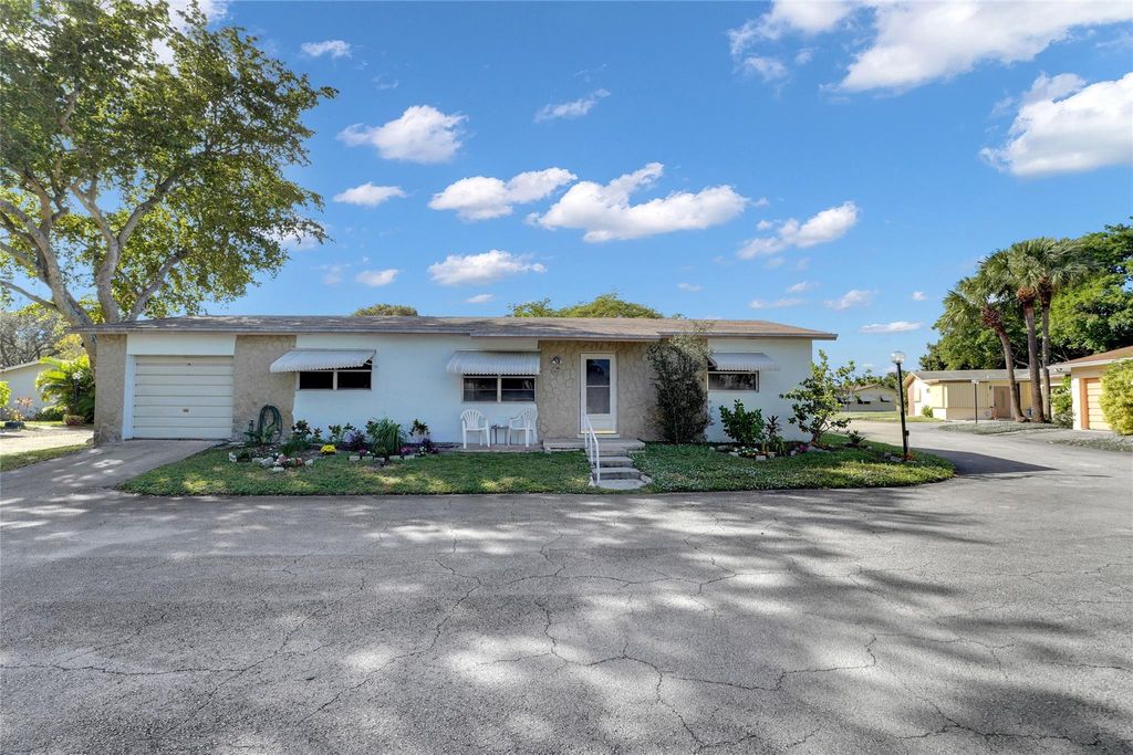 Photo of 2617 SW Natura Ave, Deerfield Beach, FL 33441 (MLS # F10531639)