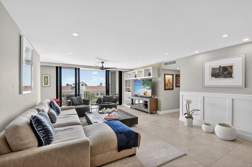 TURNKEY BRIGHT SUNNY CORNER RESIDENCE WITH OCEAN AND INTERCOASTAL VIEWS & Deeded Beach Access. Beautifully renovated and impeccably maintained, this sun-filled corner unit offers sweeping water views from every room, overlooking the ocean or the intracoastal. Impact windows, custom wainscoting, crown molding, 7'' baseboards, and 24'' porcelain tile flooring create a cohesive and refined interior. The updated kitchen and baths remain stylish and functional, complemented by abundant natural light throughout. A combo washer/dryer is included for added convenience. Deeded ocean access is located just across the street. Ideally situated near restaurants, shops, and the Farmer's Market, this residence offers exceptional walkability and effortless coastal living. Covered parking #93, uncovered #9