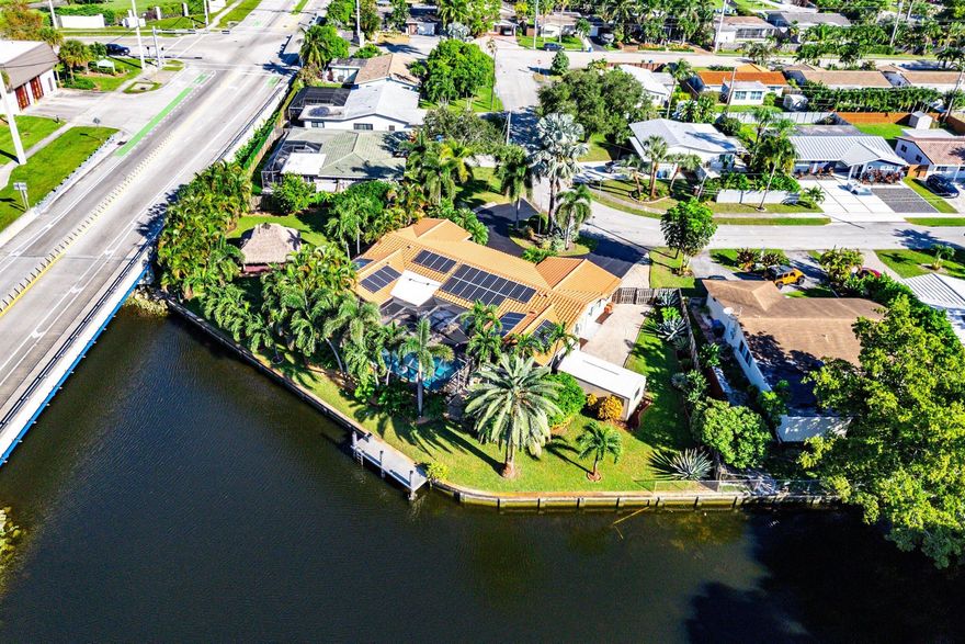 Welcome to 2074 NW 38th Street, offering exceptional value in waterfront living. Perfectly situated on an expansive double lot with nearly 200 feet of water frontage and direct access to the Middle River, this fully renovated residence embodies the essence of South Florida living.The home features a desirable split floor plan, with the primary suite opening directly to the pool and three guest bedrooms thoughtfully positioned on the opposite side for privacy. Notable upgrades include complete impact glass, a 2017 tile roof, whole-house generator (2021), newer composite dock (2020), Tiki Hut, hot tub, and spacious storage shed.Designed for entertaining and relaxed waterfront enjoyment, this home is a rare find. Schedule your private tour today.
